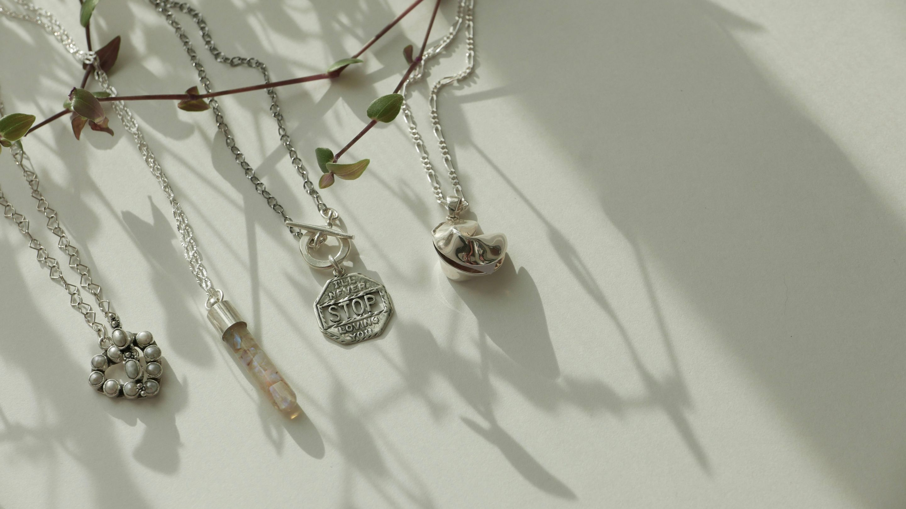 silver diamond necklace on quartz crystal